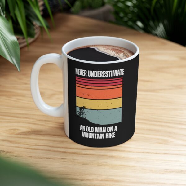 Never Underestimate An Old Man On A Mountain Bike coffee mug